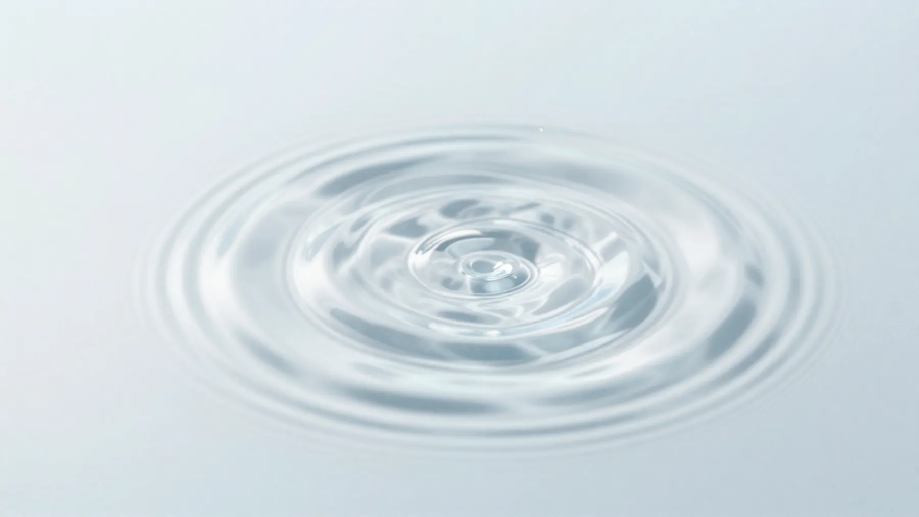 Ilustración: ondas concéntricas en agua cristalina.